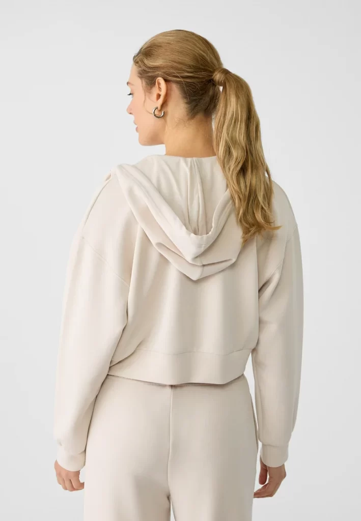 سویشرت زیپ‌دار کرمی زنانه