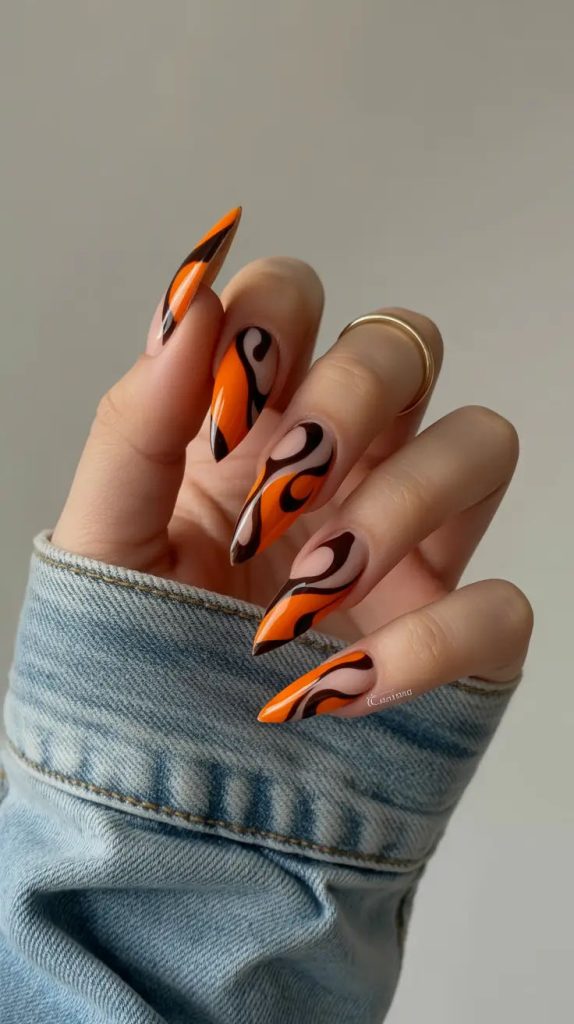 ناخن بلند صورتی و سیاه و نارنجی