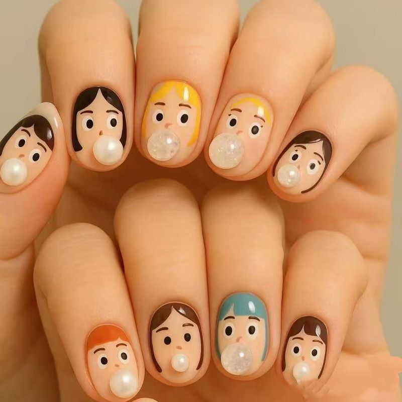 دیزاین ناخن کوتاه با طرح صورت کودک های مختلف