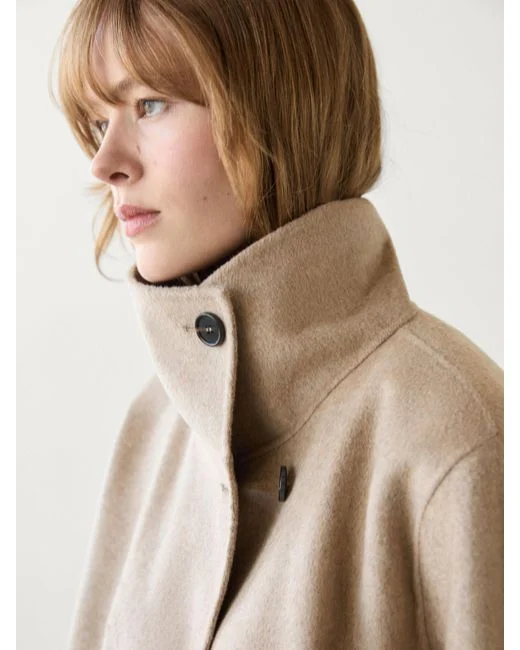 کت بافتی یقه‌بلند زنانه زرد کرمی